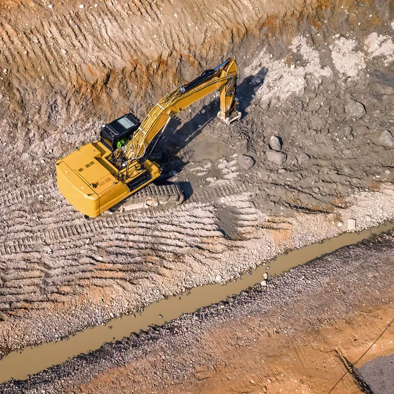 Heavy excavator ripping big stones Heavy excavator ripping big stones